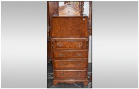 A Reproduction Queen Anne Style Burr Walnut Bureau. With a Fall Flap. With a Fitted Interior,