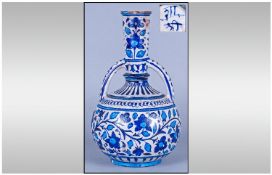 Turkish Otterman Style Early 20th Century Vase, with blue floral decoration. Stands 11 inches high.