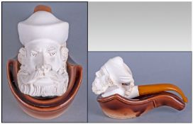 Carved Meerschaum  Pipe, bearded figural head bowl. Amber mouthpiece, with ceramic pipe rest.