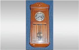 1930`s Oak Cased German Box Clock with a round steel dial, 8 day movement with a glazed door front.