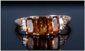 Madeira Citrine Trilogy Ring with diamond accents, the three Madeira citrines, cushion cut, the