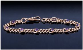 A Vintage 9ct Gold Curb Bracelet set with eight cabuchon cut amethysts of good colour. Fully