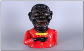 Cast Iron Jolly Money Box with moving arm and red coat. 6`` in height.