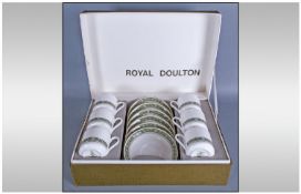 Royal Doulton Boxed Coffee Set comprising 6 coffee cans and saucers. Green border on white ground.