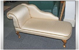 Champagne Satin Chaise Lounge with gilt tapering gilt legs. 44 inches wide.