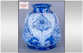 WITHDRAWN      Florian Ware Vase, white Art Nouveau tubelining with shades of blue on a squat