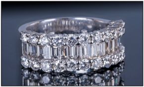 18ct White Gold Diamond Ring, set with a central row of Baguette cut Diamonds between two rows of