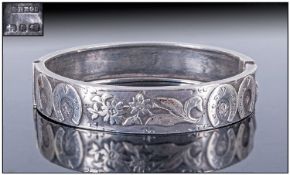 Late Victorian Silver Hinged Bangle, The Front With Applied Raised Horseshoe And Floral Decoration,