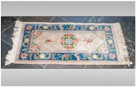 Small Hallway Wool Rug, predominantly beige ground with red and blue decoration 54 by 28 inches