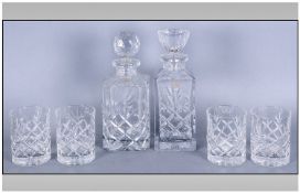 Two Cut Glass Decanters With Star Cut Bases by Boyne Valley together with four matching glass