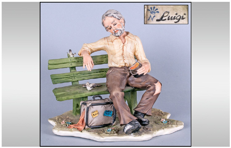 Capodimonte Early And Signed Figure, Tramp on a bench with suitcase hotel Plaza. Signed Luigi.