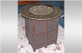 Large Unusual Indian Brass Topped Coffee Table with a shaped engraved top in traditional style.