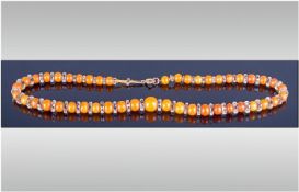 Butterscotch Amber and Glass Rondelle Necklace, the amber beads of round form graduating from