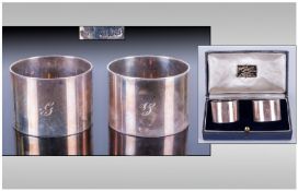 One Boxed Silver Napkin Rings two matching napkin rings, plain finished, engraved initial on both.