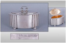 A Silver Cigarette Box Of German Manufacture, the main section with ribbed design, a plain finish &