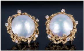 Pair Of Ladies 18ct Gold Earrings, Set with a large Baroque Pearl between five round modern