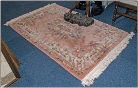 Quality Woolen Chinese Rug, Central Floral & Border Design On Peach Ground. Tasseled fringing.