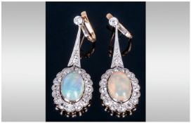 Pair Of Ladies 18ct Gold Opal & Diamond Drop Earrings, each set with a large polished milk Opal