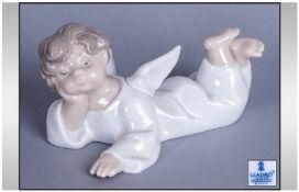 Lladro Figure `Angel Reclining` Number 4541, Issued 1969. 6`` in length,