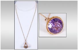 Edwardian 9ct Gold Fob set with a large faceted Amethyst of 10cts & fitted on a gold trace chain.