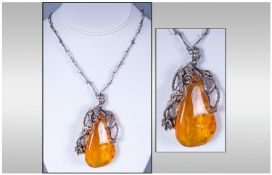 Large Amber Freeform Pendant With Large Foliate Applied Silver Mount, Appears Unmarked, Tests