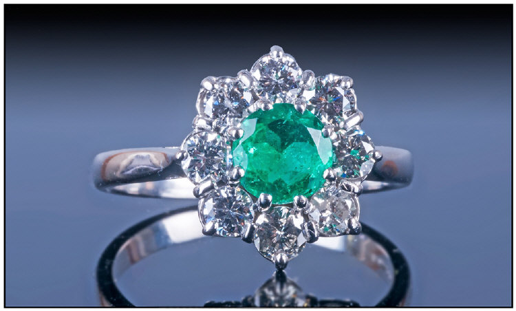 18ct White Gold Set Emerald And Diamond Cluster Ring. The central natural single stone Columbian