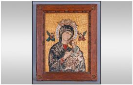 A Painted Icon of `The Madonna` on A Tin Panel. With cut out and gilded work applied. In a carved