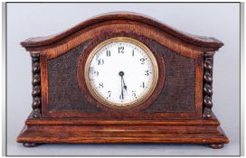 Oak Cased Mantle Clock, ceramic dial and Arabic numerals. 7 inches high and 10 inches wide. c 1920`