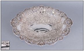 An Oval Silver Bowl embossed and pierced with a floral and beaded pattern. Weight 11.78ozs.