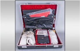 A solid Attache Case Containing A Telesales Training Kit with telephones and tape recorder.