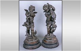 A Pair Of French Spelter Figures Of Winged Putti Playing A Mandolin And A Flute. French 19th