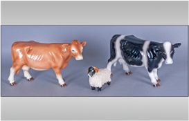 Two Various Leonardo `Country Life` Cows, one light tan, one black with white markings, each 9