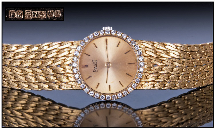 Piaget-Ladies 18ct Yellow Gold Diamond Set Bracelet Watch. Circa 1970s. Champagne Dial, The Bezel