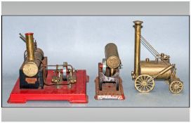 Mamod Tinplate Steam Engine Model on a painted red base, a smaller part version, similar, plus a