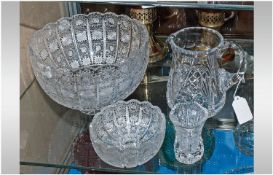 Four Pieces Of Quality Cut Glass Comprising fruit bowls, small bowl & jug & water jug.