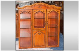 Contemporary Glazed Cabinet On Cupboard Base in walnut colour. The top with three glazed doors, an