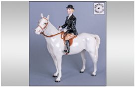 Beswick Huntswoman on Grey Horse, the lady rider shown in black jacket and bowler style hat, the
