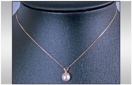 9ct Gold Cultured Pearl Pendant, suspended on a 9ct gold chain.