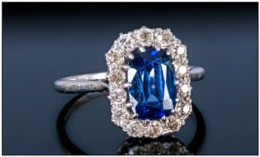 Ladies Platinum Sapphire And Diamond Ring, Central Oval Cut Medium Dark Sapphire (8.03 x 5.57 x 4.