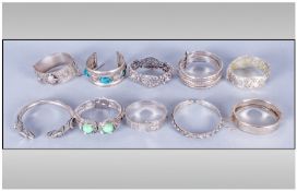 A Collection Of Siver & White Metal Assorted Bangles, 10 in total. From different parts of the