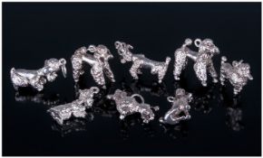 Collection of Eight Heavy Silver Poodle Charms.