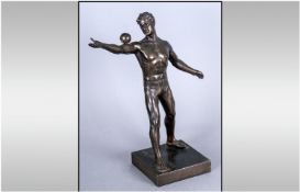 A 1930`s German Spelter Figure Of A Semi Clad Athlete balancing a ball on his arm. 11`` in height.