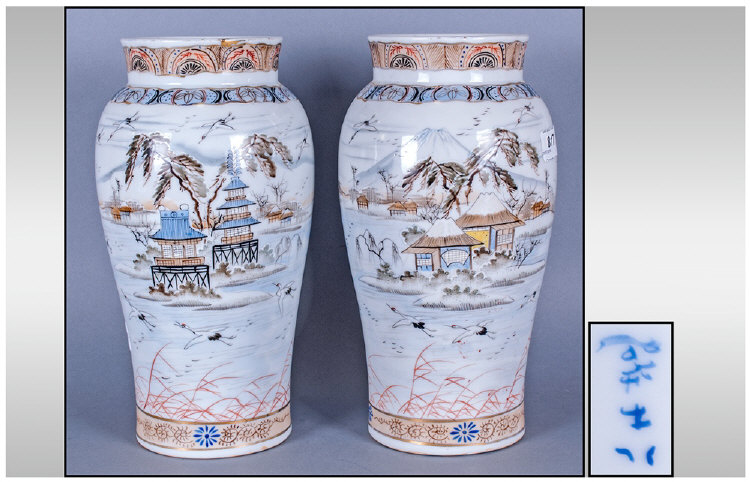 Pair Of Large Japanese Vases, Decorated with continuous landscape scenes showing Mount Fuji and
