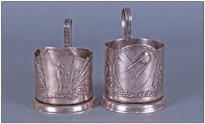Two Silvered Metal Tea Cup Holders. Touch marks to the base, depicting to the front victory