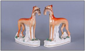 Pair Of Antique Staffordshire Pottery Figures Of Grey Hounds, finely potted and realistic dogs of