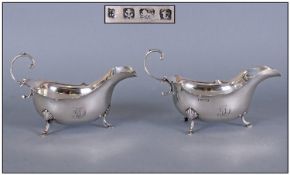 A Fine Silver Pair Of Sauce Boats Features Include wavey borders, scroll handles, shell & hooped