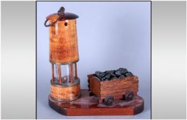 Oak Miners Lamp & Mine Cart on wooden plinth. 11.5`` in height. 12`` in width.