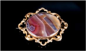 19th Century Banded Agate Brooch Of Oval Form, Mounted In An Unmarked Yellow Metal Mount With