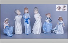 Nao by Lladro selection of 6 Figures. Comprises A Boy and Girl in White Standing 10 Inches Each. A