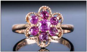 Vintage 9ct Gold Set Ruby Cluster Ring with flowerhead design, The central ruby surrounded by a